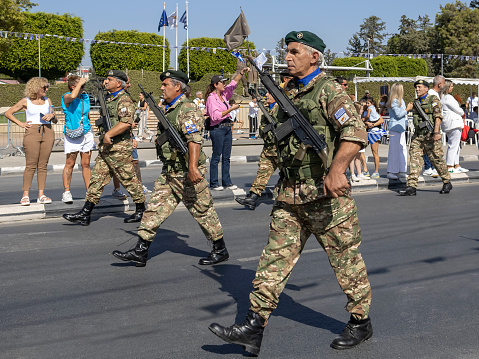 Limassol, Cyprus, October 28th, 2023: Mature National Guard soldiers marching on Ohi Day parade along Archbishop Makarios III Avenue