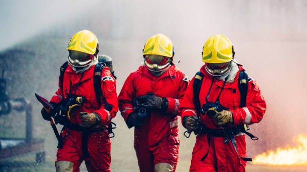 istock Firefighter in Full Protective Gear. Heroic Fireman Combats Intense Blaze with Life-Saving Equipment. 1766873404