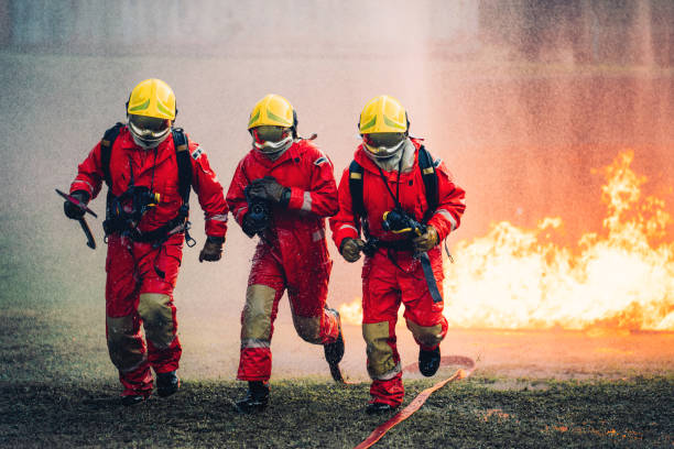 istock Firefighter in Full Protective Gear. Heroic Fireman Combats Intense Blaze with Life-Saving Equipment. 1766874455
