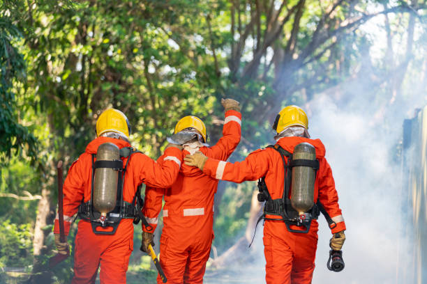istock Firefighter in Full Protective Gear. Heroic Fireman Combats Intense Blaze with Life-Saving Equipment. 1766876709