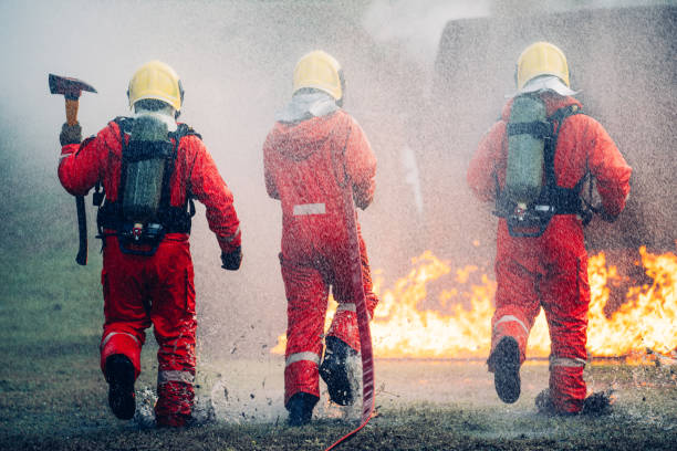 istock Firefighter in Full Protective Gear. Heroic Fireman Combats Intense Blaze with Life-Saving Equipment. 1766877281