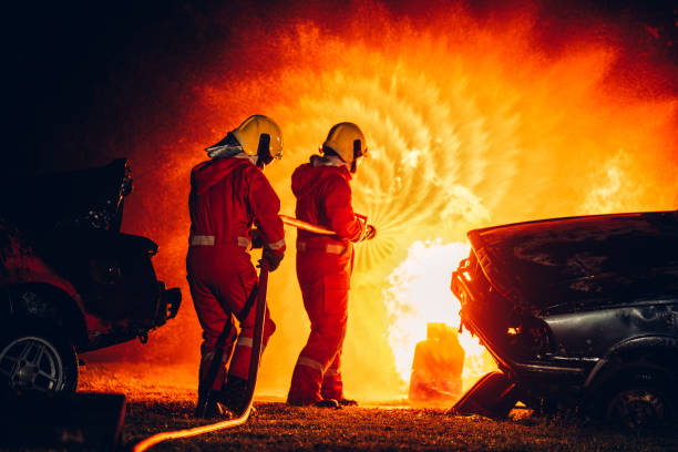 istock Fearless Firefighters Battling Blaze with Water and Extinguishers. Firefighters in Action, Extinguishing Fire with Teamwork and Courage. Intense Firefighting Training Exercise. 1766882876