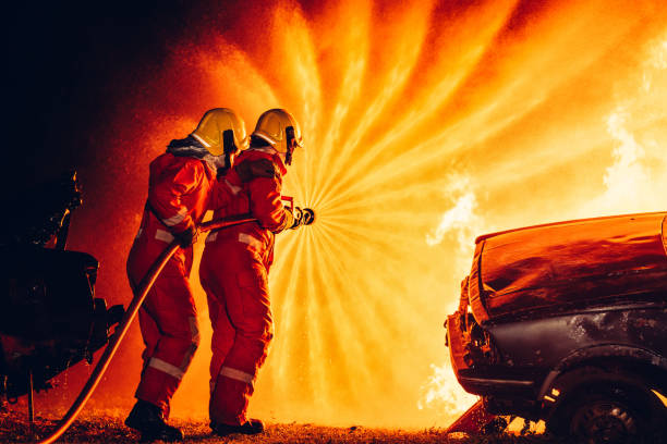 istock Fearless Firefighters Battling Blaze with Water and Extinguishers. Firefighters in Action, Extinguishing Fire with Teamwork and Courage. Intense Firefighting Training Exercise. 1766888443