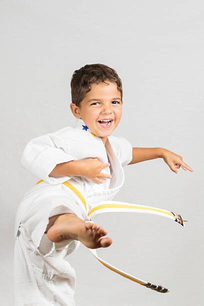 boy karate kick - child karate little boys martial arts fotografías e imágenes de stock