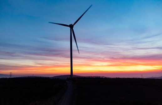 Beautiful sunset above the wind turbine