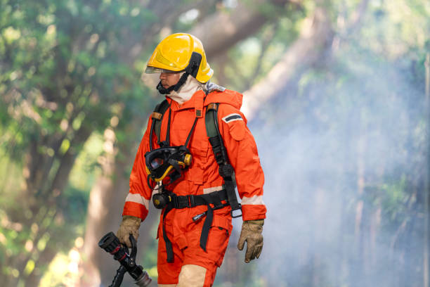 istock Firefighter in Full Protective Gear. Heroic Fireman Combats Intense Blaze with Life-Saving Equipment. 1766898922