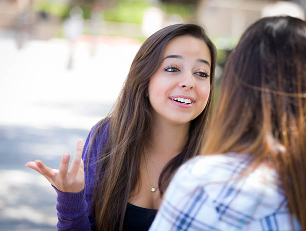 istock Expressive Young Mixed Race Female Sitting and Talking with Girl 176690140