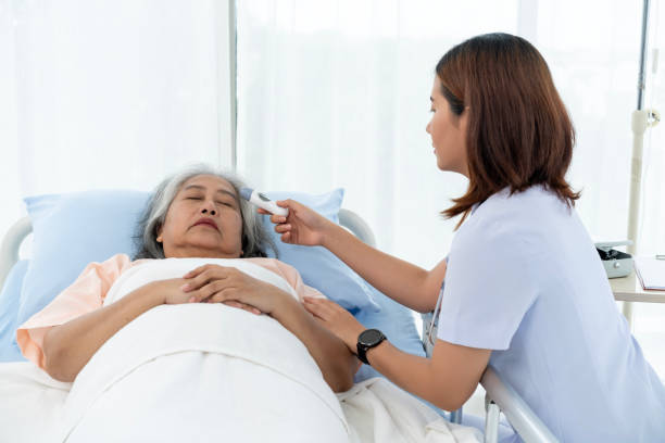 istock Nurse uses a digital thermometer to take her temperature. 1766911372