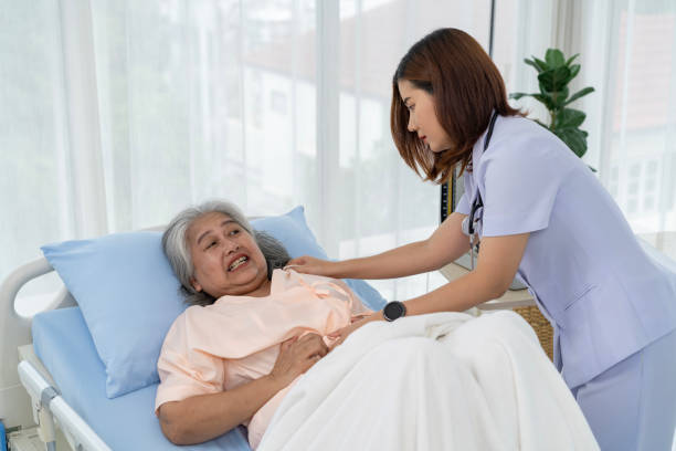 istock A nurse or caregiver for an elderly patient is helping a patient with severe stomach problems 1766913795