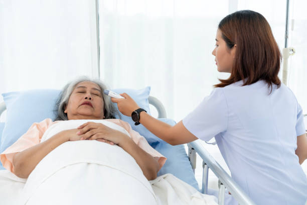 istock Nurse uses a digital thermometer to take her temperature. 1766914967