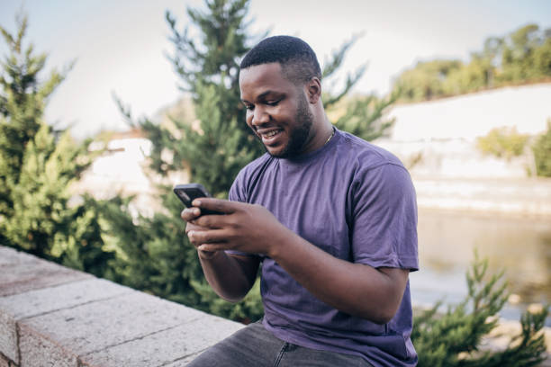 istock Young man using mobile phone in the city 1766927265