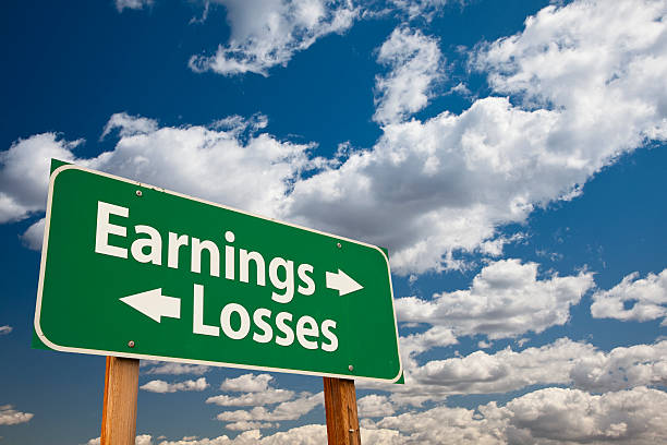 istock Earnings, Losses Green Road Sign Over Clouds 176693422