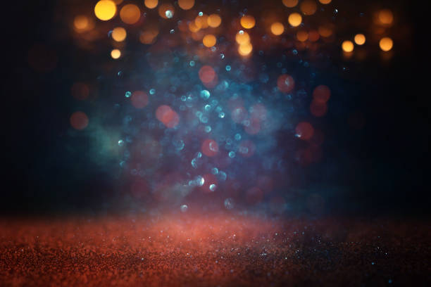 istock abstract glitter black, blue and gold lights background. de-focused 1766948271