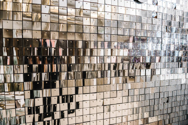 istock Silver glitter sparkles on background. Space with flickering and glittering metallic particles. Wall is made of square glittering sequins. Decor and interior decoration. Place for text. Closeup. 1766948572