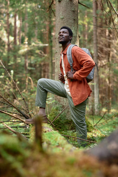 istock Young man hiking in the forest 1766965737