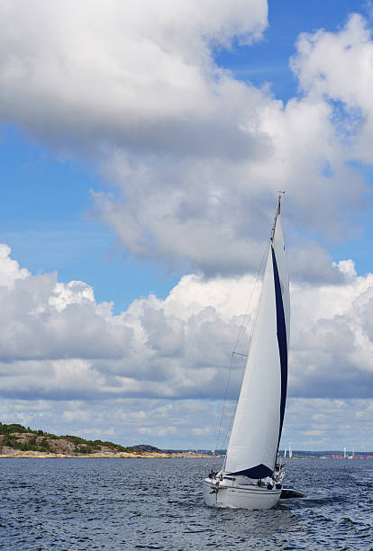 istock Single sail boat on the lake 176697044