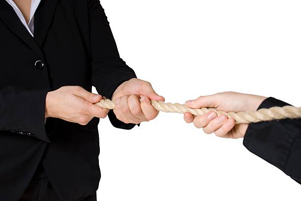 tug of war tug of war between business people, isolated vinner stock pictures, royalty-free photos & images
