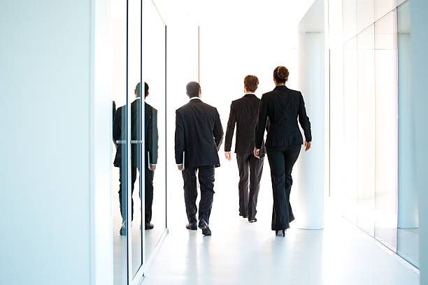 istock group of business people walking away 176697985