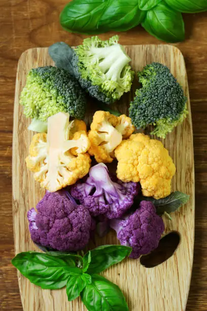 Photo of colorful broccoli cabbage on a wooden board
