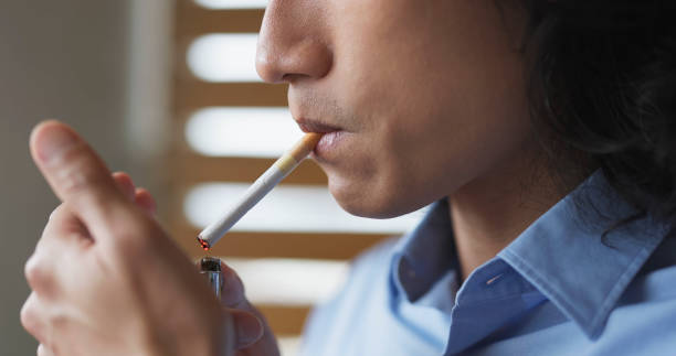 istock asian man smokes cigarette 1766994060