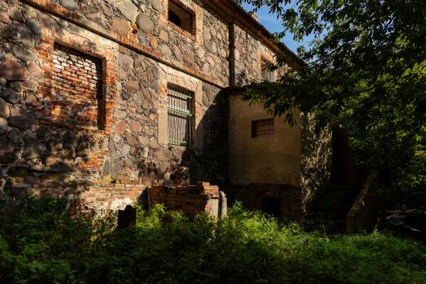 istock an old building surrounded by trees on a sunny day near some bushes 1767003380