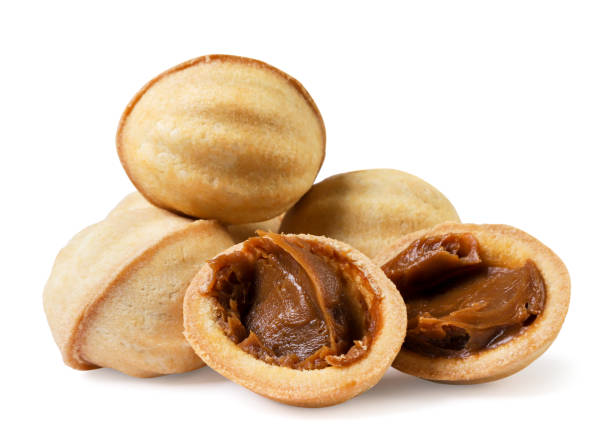 istock Cookies shaped nuts and halves with filling on a white background. Isolated 1767003969