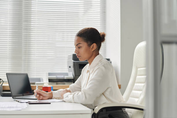 istock Visa center employee working in office 1767011344