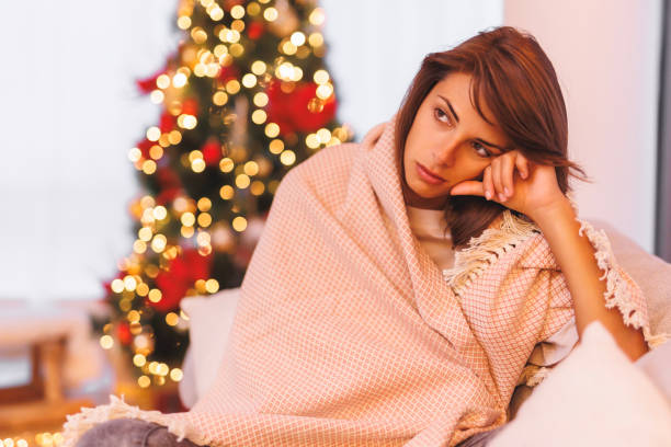 istock Sad woman alone at home on Christmas day 1767014483