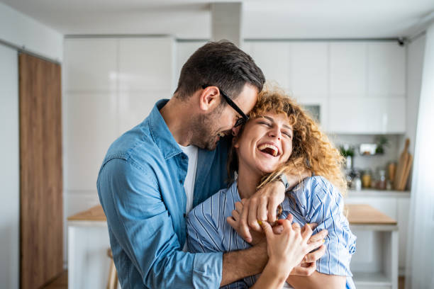 A wonderful scene of love and happiness between a couple in love enjoying their new apartment stock photo