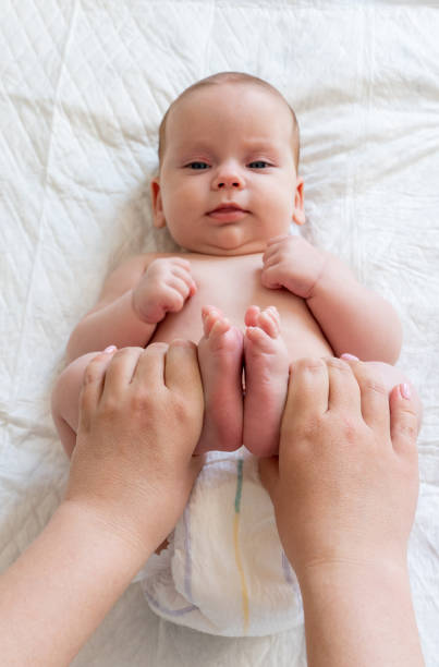 istock Constipation troubles eased by massage. Concept of infant well-being 1767019045
