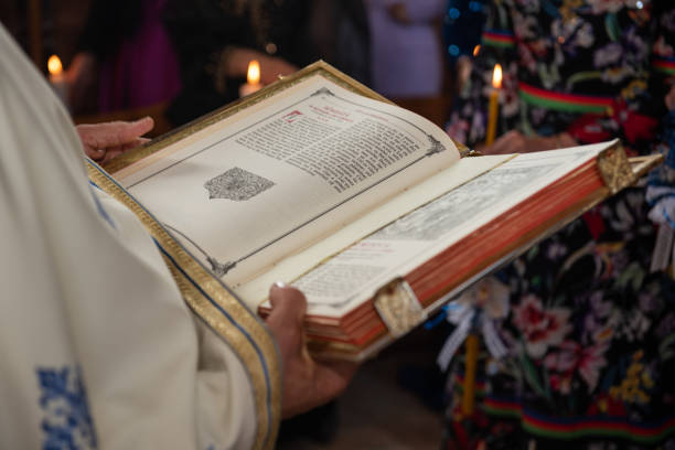 istock priest's hands over the gospel 1767020756