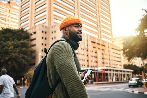 City, thinking and black man with a cellphone, smile and connection with social media, travel and website info. African person, mobile user or guy with smartphone, digital app or outdoor with contact