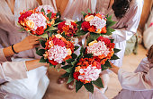 Close up of bridal party with floral bouquets