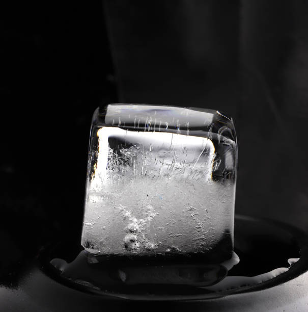 istock Ice cube on black background. Low key photo. 1767035401
