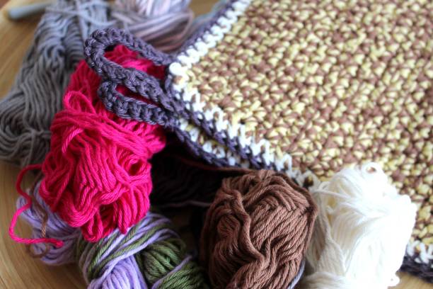 istock Crochet pretty things from wool scraps, for example pot holders made from cotton yarn. 1767038266