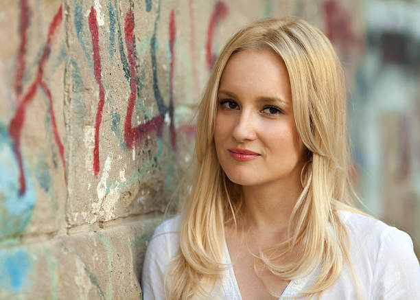 istock Young female standing against a wall 176704278
