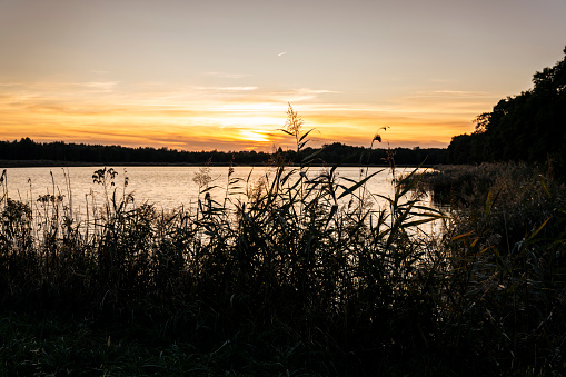 A beautiful colourful spring sunset over the sixfields lake in Northampton, England