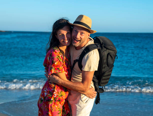 istock Romantic couple embracing at the hot beach at sunset 1767063915
