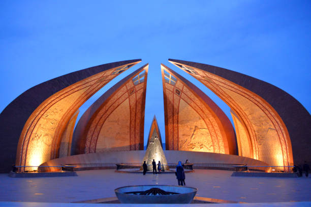 istock Pakistan monument - square and silhouetted people at dusk, Islam 1767094300