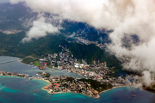 Troise frere nature trail, view of the international airport, providance, copolia mountain, turqouise water and cloudy sky, Mahe Seychellesh