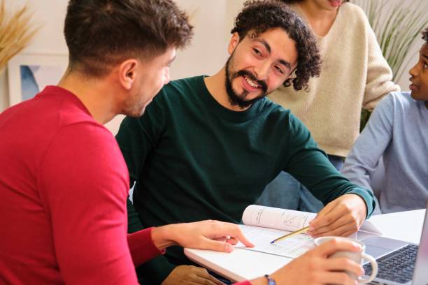 istock Group of diverse university colleagues studying together at shared flat. 1767097738