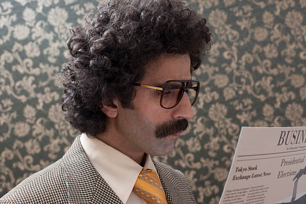 istock Businessman with big hair reading newspaper 176710255