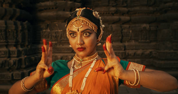 istock Close-Up of an Indian Female Dancer Displaying Symbolic Gesture with Expressive Face, Using Folkloric Dance to Tell a Story. Girl in Traditional Sari Showcasing the Art of Mudras Movement 1767113157