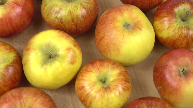 Fresh apples are on a board, background