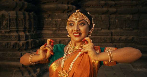 istock Portrait of an Indian Female Dancer Displaying Symbolic Gesture with Expressive Face, Using Folkloric Dance to Tell a Story. Girl in Traditional Sari Showcasing the Art of Mudras Movement 1767114440