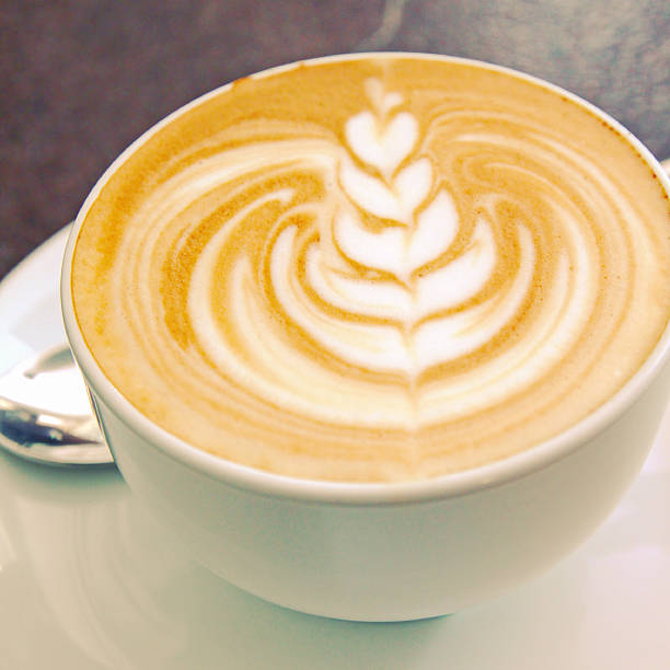 istock Cappuccino or latte art coffee with retro filter effect 176712554