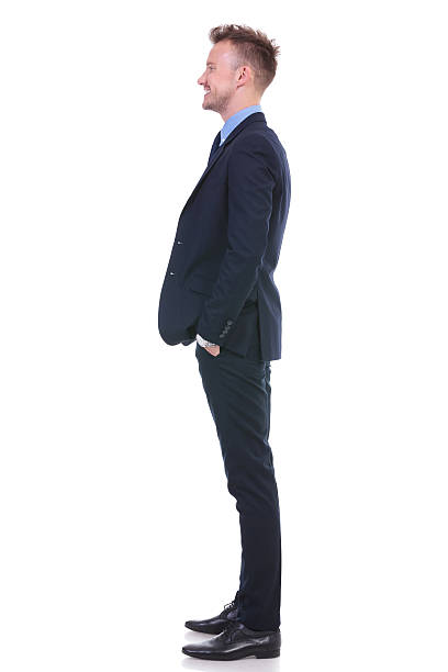 istock business man stands sideways and smiles 176712723