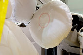 Close-up of a car seat with airbags inflated