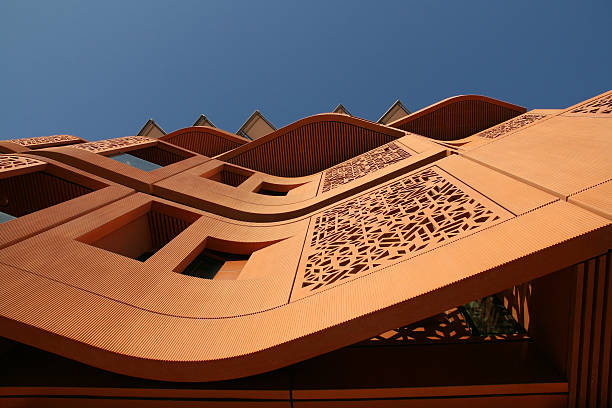 Heat reflective facade in Masdar City Bottom-up view of a facade in Masdar City in Abu Dahbi, United Arab Emirates. abu dhabi stock pictures, royalty-free photos & images