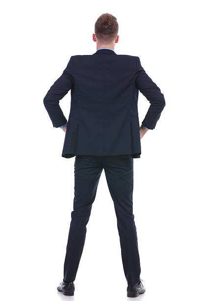 istock back of a business man with hands on hips 176713426